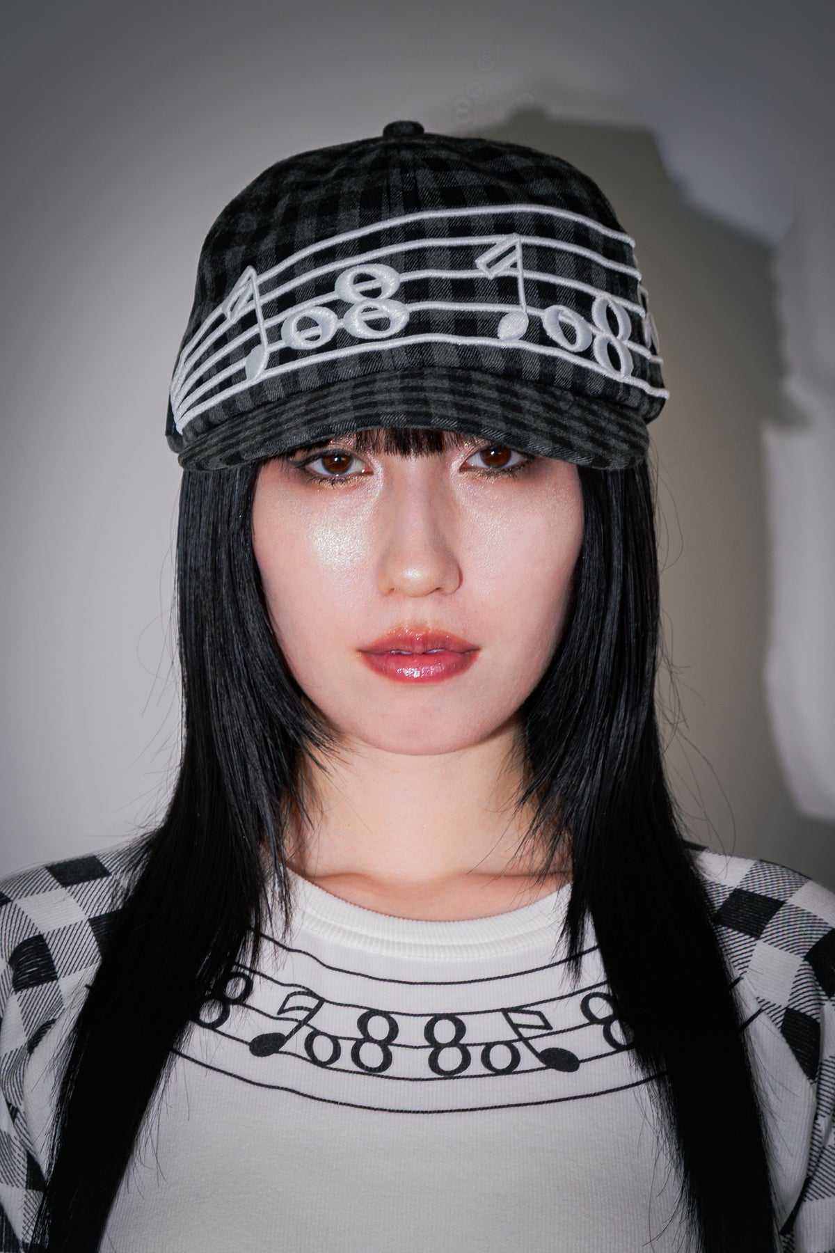 Embroidery of music note on plaid fabric Cap